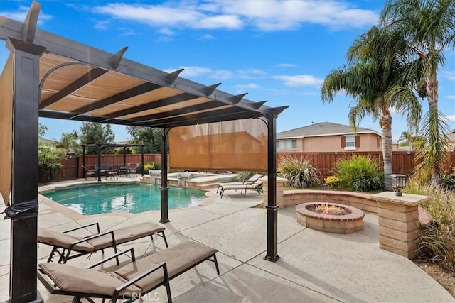 view of pool featuring an in ground hot tub, a patio, a pergola, and a fire pit