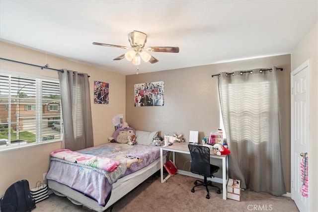 carpeted bedroom with ceiling fan