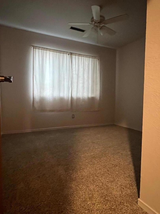 unfurnished room featuring carpet floors and ceiling fan