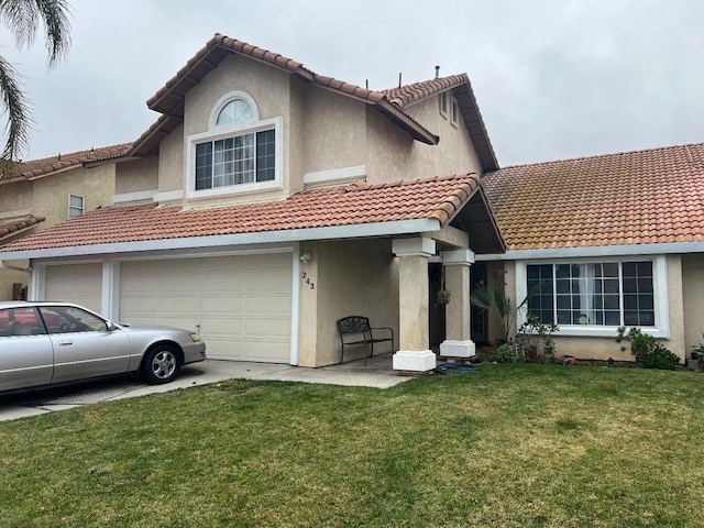 view of front of home with a garage and a front lawn