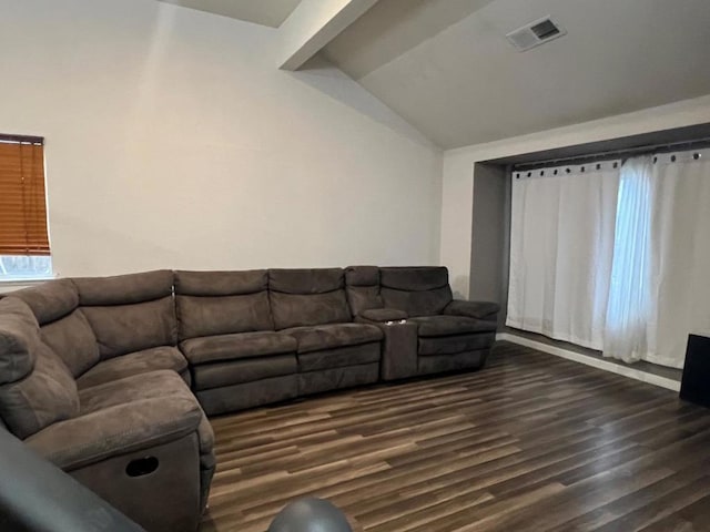 living room featuring dark hardwood / wood-style floors and vaulted ceiling