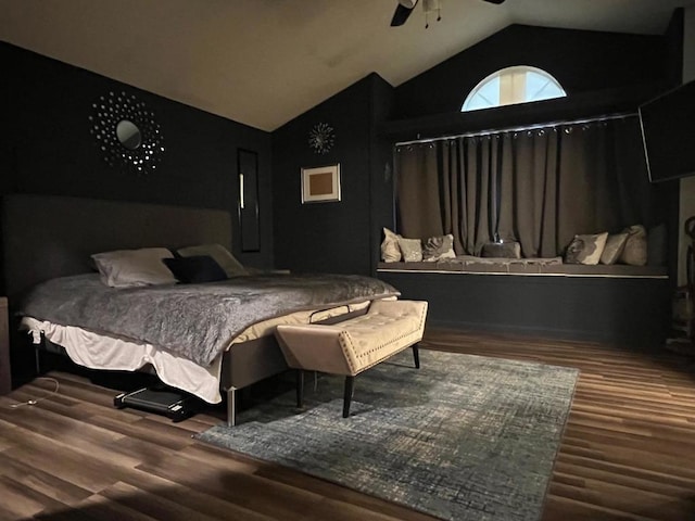 bedroom featuring ceiling fan, hardwood / wood-style floors, and lofted ceiling