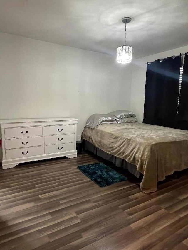 bedroom featuring dark hardwood / wood-style floors