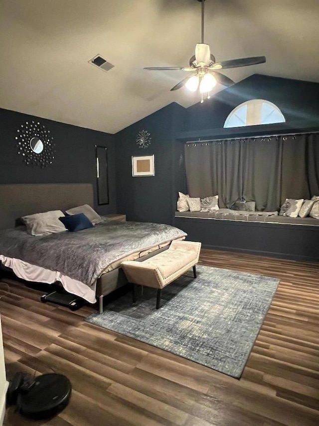 bedroom featuring ceiling fan, wood-type flooring, and lofted ceiling