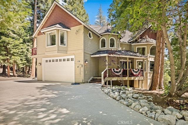 view of front of house featuring a garage and covered porch