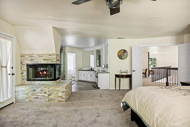 28670 Shenandoah Dr, Lake Arrowhead, CA 92352 - carpeted bedroom with a multi sided fireplace and connected bathroom