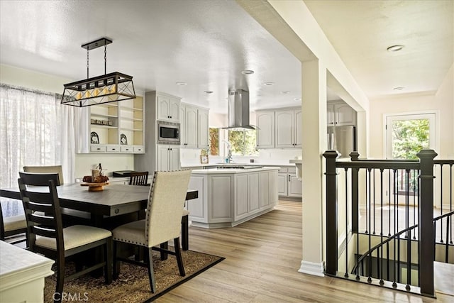 28670 Shenandoah Dr, Lake Arrowhead, CA 92352 - dining space with light wood-type flooring