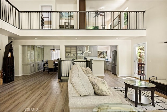 28670 Shenandoah Dr, Lake Arrowhead, CA 92352 - living area featuring a towering ceiling, light wood-style floors, and ceiling fan