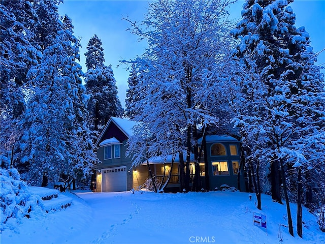 28670 Shenandoah Dr, Lake Arrowhead, CA 92352 - view of front of property featuring an attached garage and covered porch