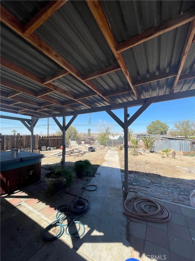 view of patio with a hot tub