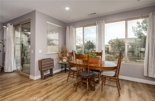 dining space featuring light hardwood / wood-style floors