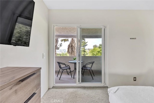 dining area featuring light colored carpet