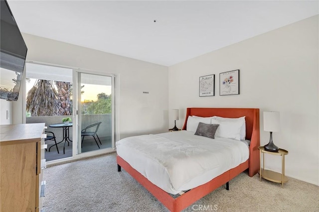 bedroom with light carpet and access to outside