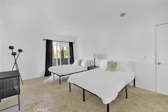 bedroom featuring light carpet