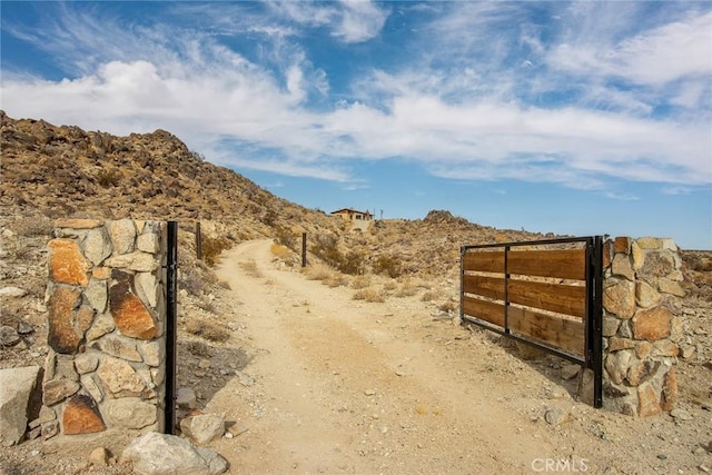 view of gate with a mountain view