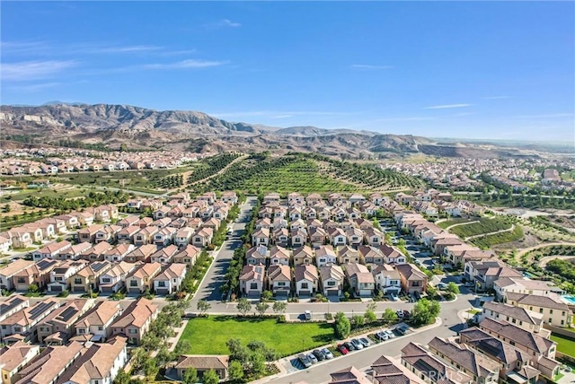 birds eye view of property featuring a mountain view