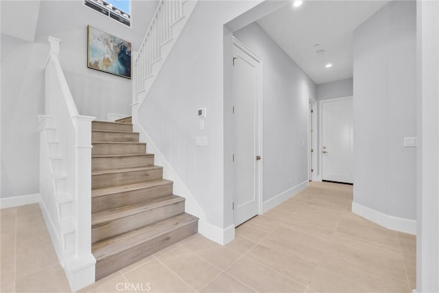 stairs with tile patterned flooring