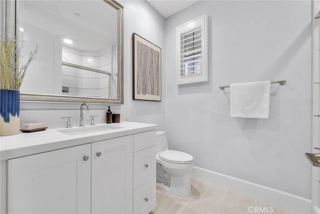 bathroom with toilet, an enclosed shower, and vanity