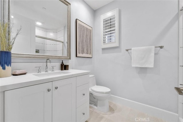 bathroom featuring toilet, walk in shower, and vanity