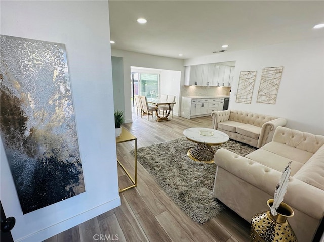 living room with light hardwood / wood-style flooring