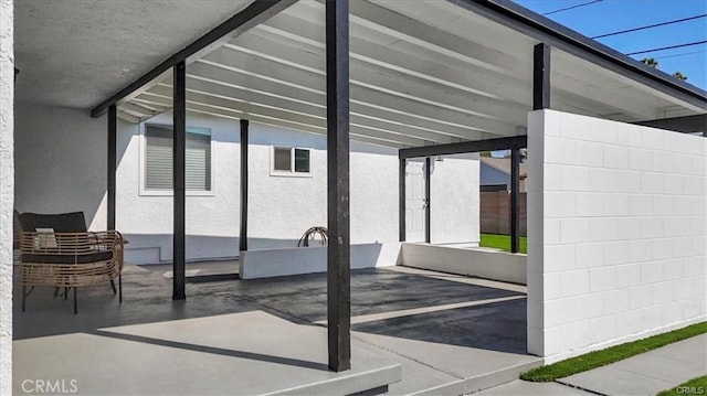 view of patio / terrace featuring a carport