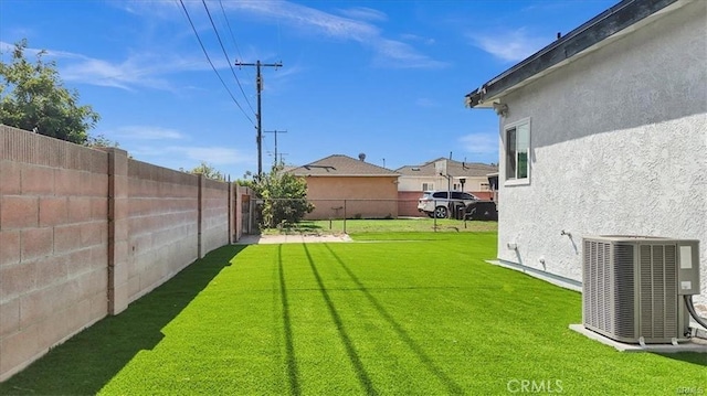 view of yard with central AC