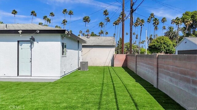 view of yard with central AC