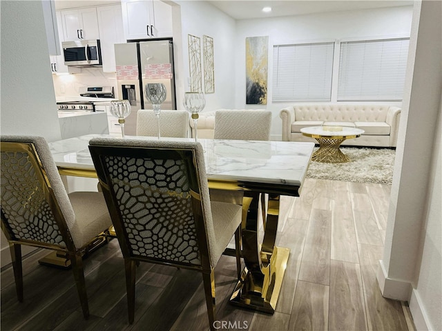 dining area featuring wood-type flooring