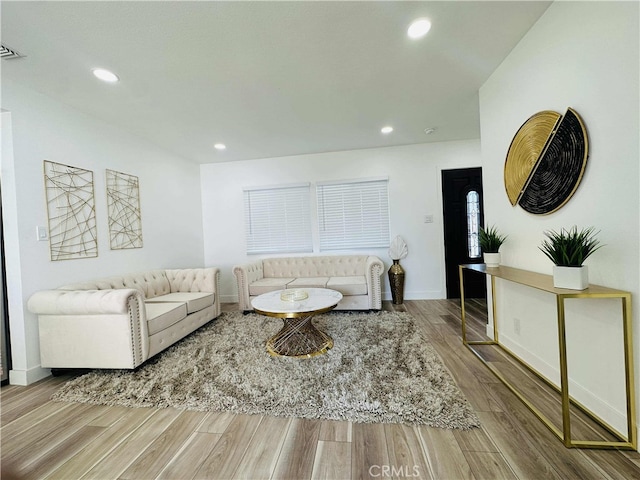 living room with light hardwood / wood-style floors