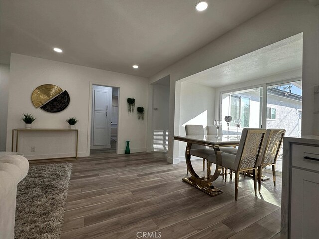 dining space featuring dark hardwood / wood-style floors