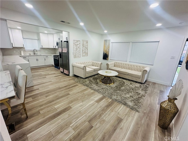 living room featuring light wood-type flooring