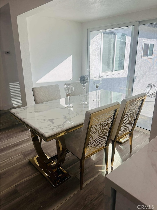 dining area featuring wood-type flooring