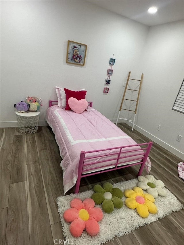 bedroom featuring dark hardwood / wood-style flooring