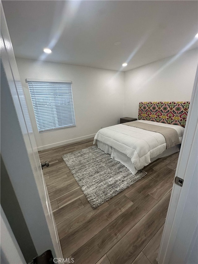 bedroom featuring dark hardwood / wood-style floors