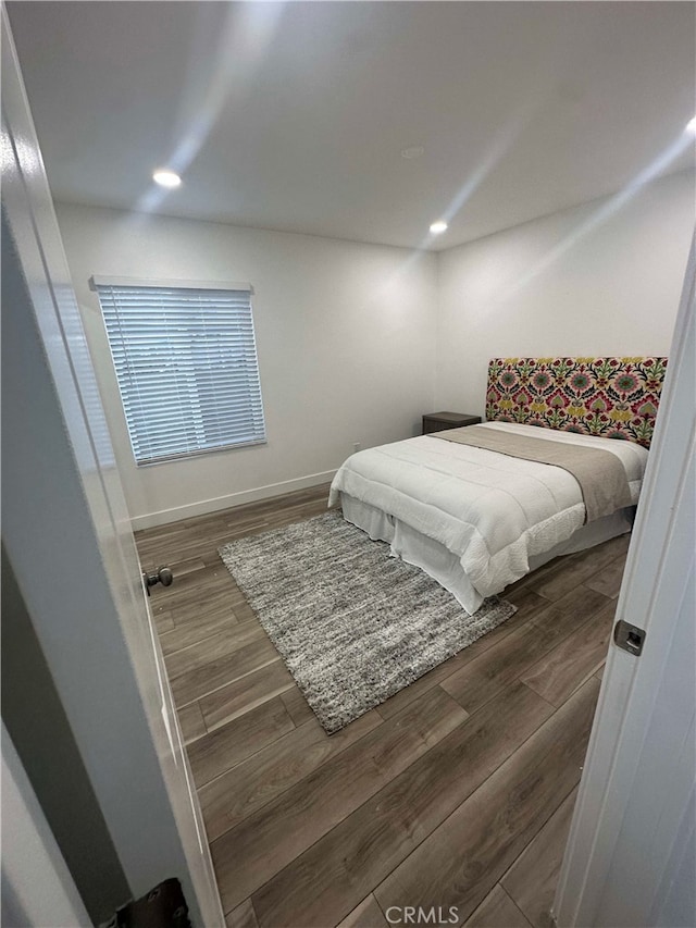 bedroom featuring dark wood-type flooring