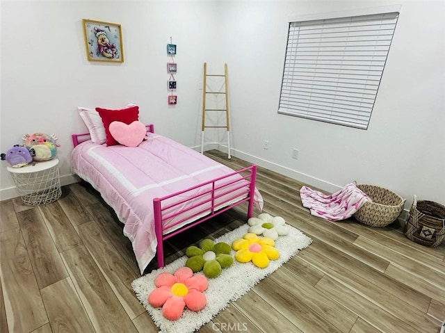 bedroom featuring hardwood / wood-style floors