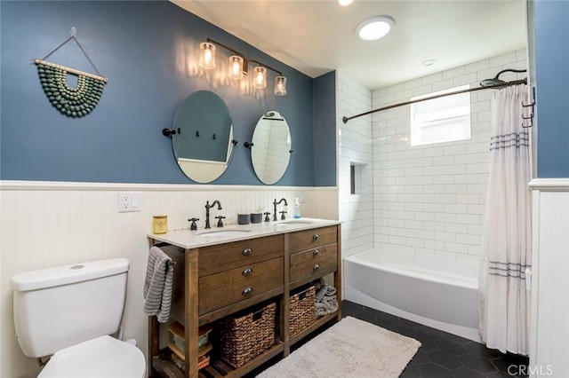 full bathroom featuring toilet, shower / bath combo, vanity, and tile patterned floors