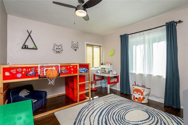 game room featuring dark hardwood / wood-style floors and ceiling fan