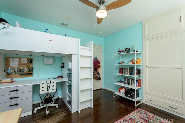 bedroom featuring ceiling fan and dark wood-type flooring