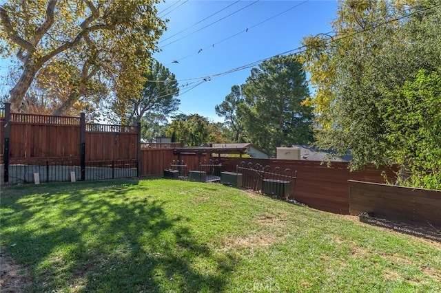 view of yard with central AC