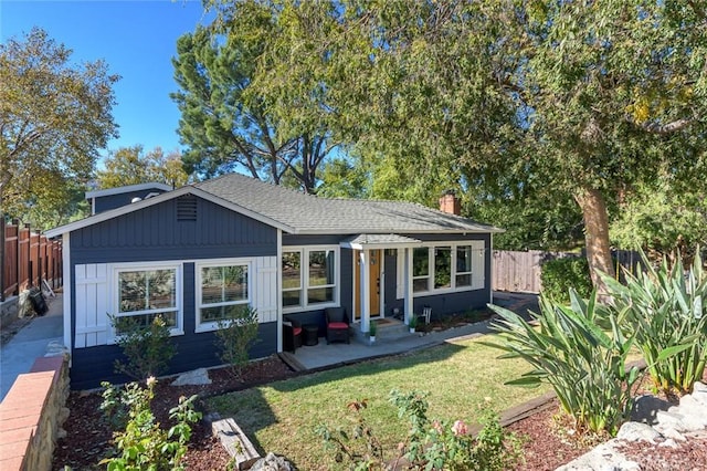 ranch-style home with a front lawn