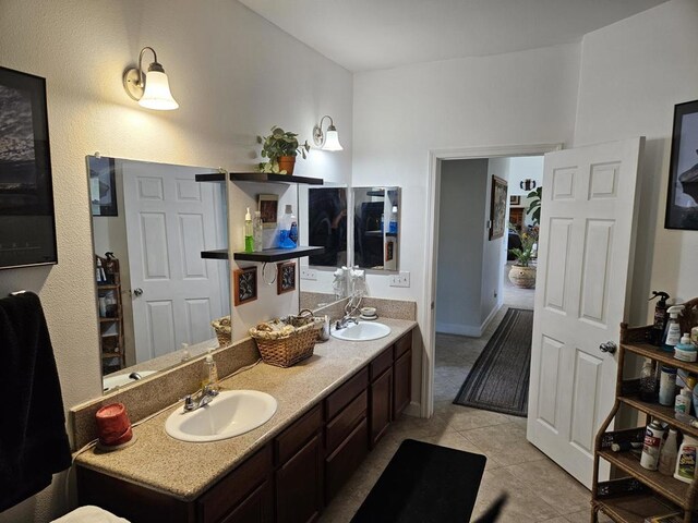 bathroom with tile patterned flooring and vanity