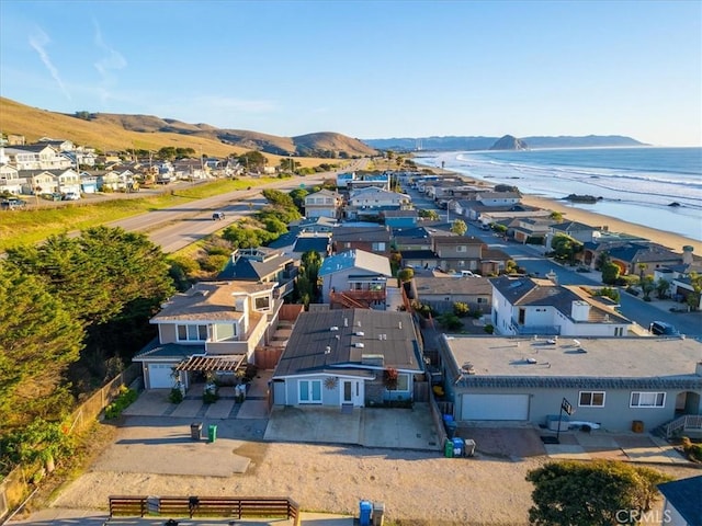 birds eye view of property featuring a water and mountain view