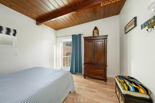 bedroom featuring vaulted ceiling with beams, wood ceiling, and light hardwood / wood-style flooring