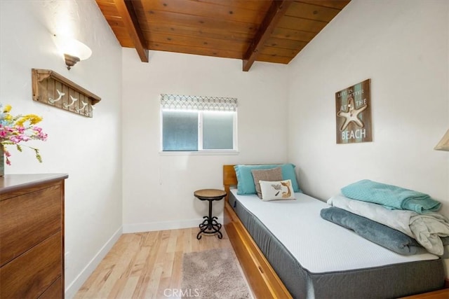 bedroom with beam ceiling, wood ceiling, and light hardwood / wood-style flooring