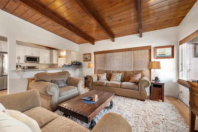 living room with vaulted ceiling with beams, wooden ceiling, and light wood-type flooring