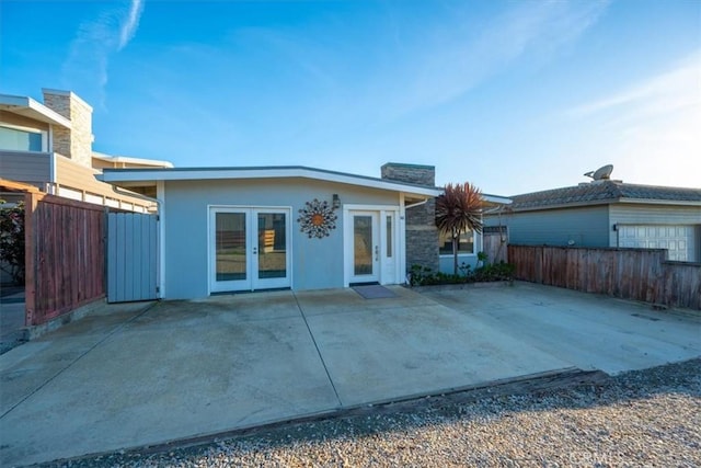 back of house featuring a patio area and french doors