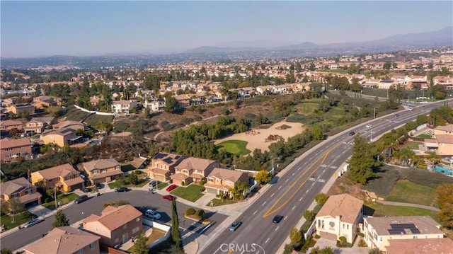 birds eye view of property with a mountain view