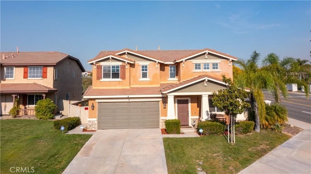 craftsman-style home featuring a garage and a front yard