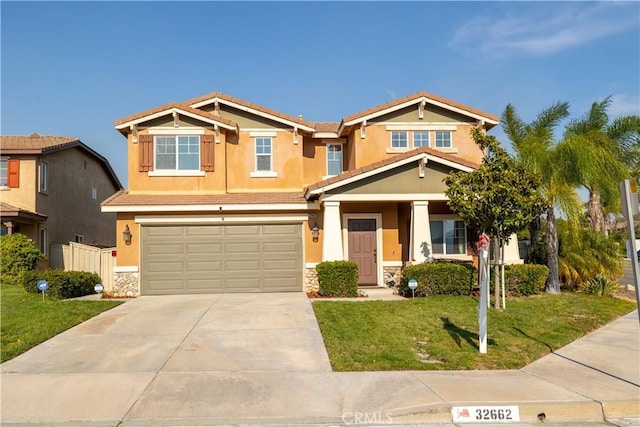 craftsman-style house with a garage and a front lawn